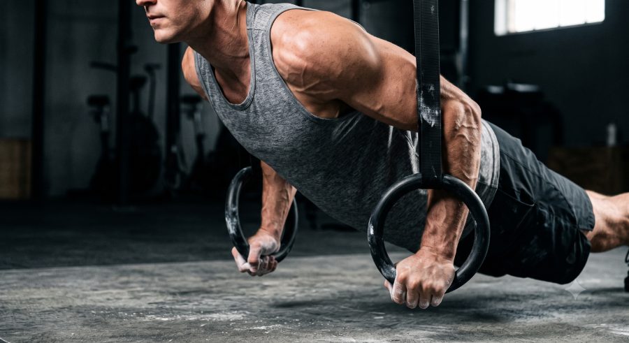 Athlete holding a gymnastic ring support
